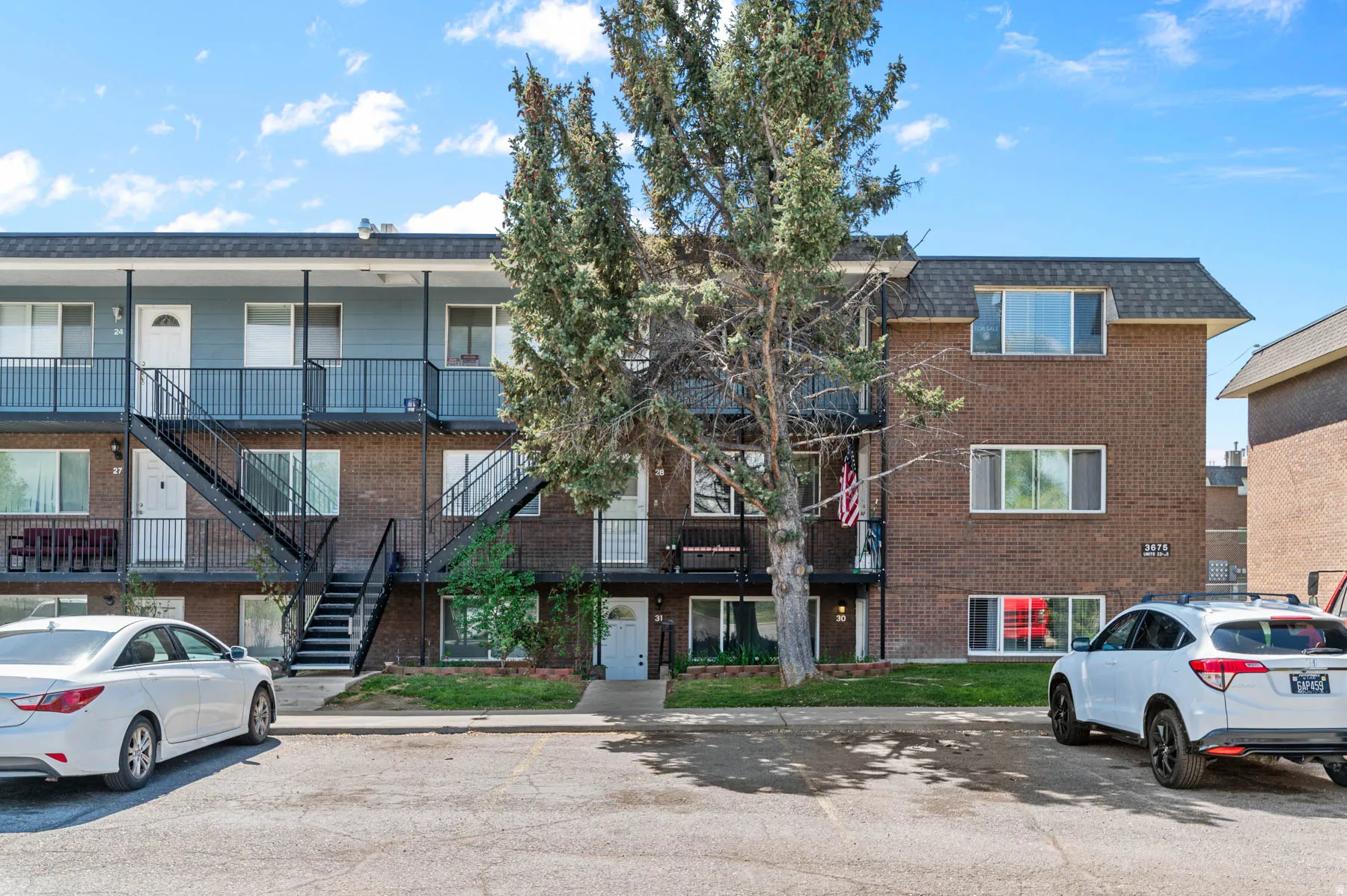 View of apartment building / complex featuring stairway