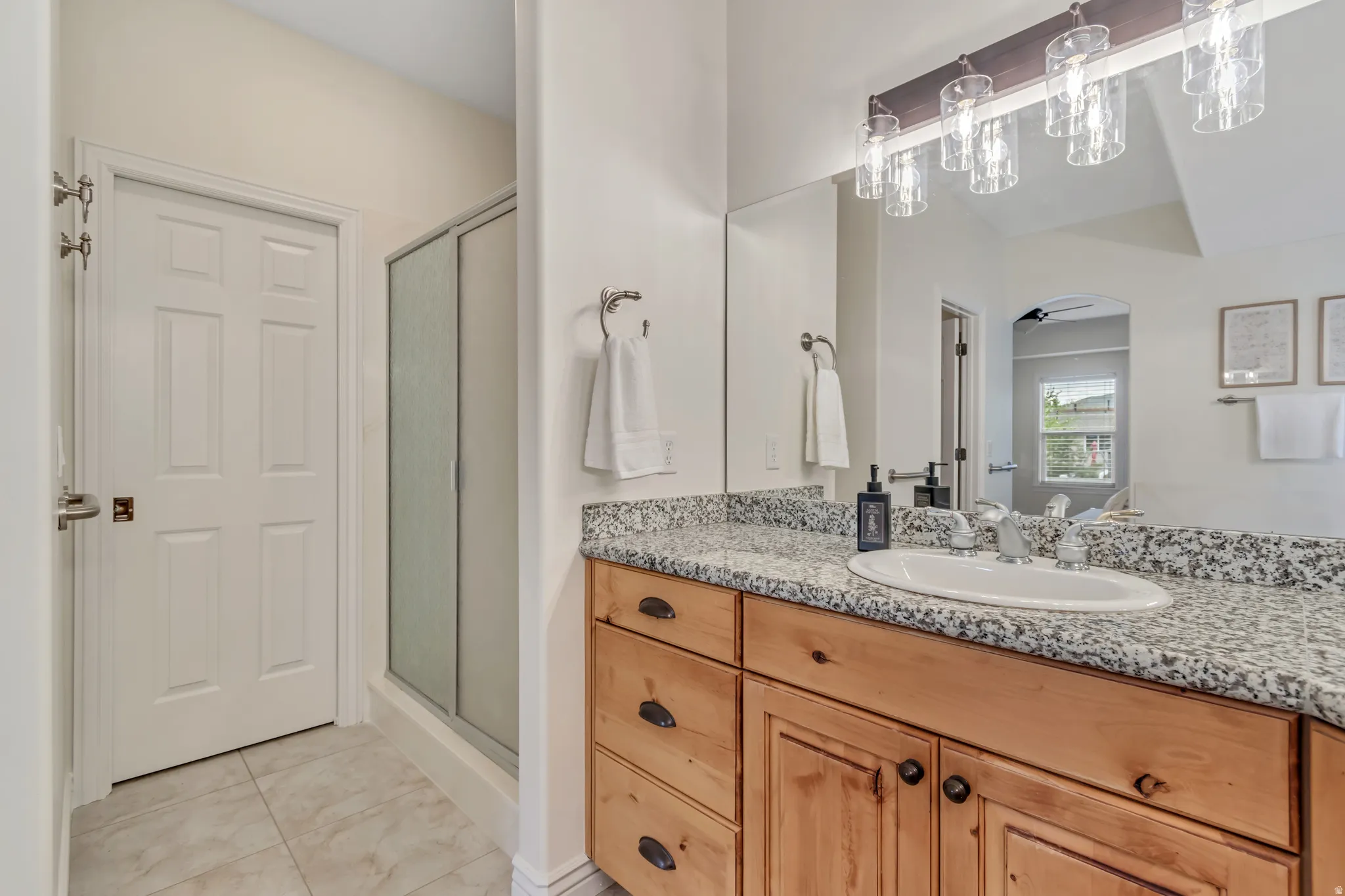 Bathroom with vanity and a shower stall
