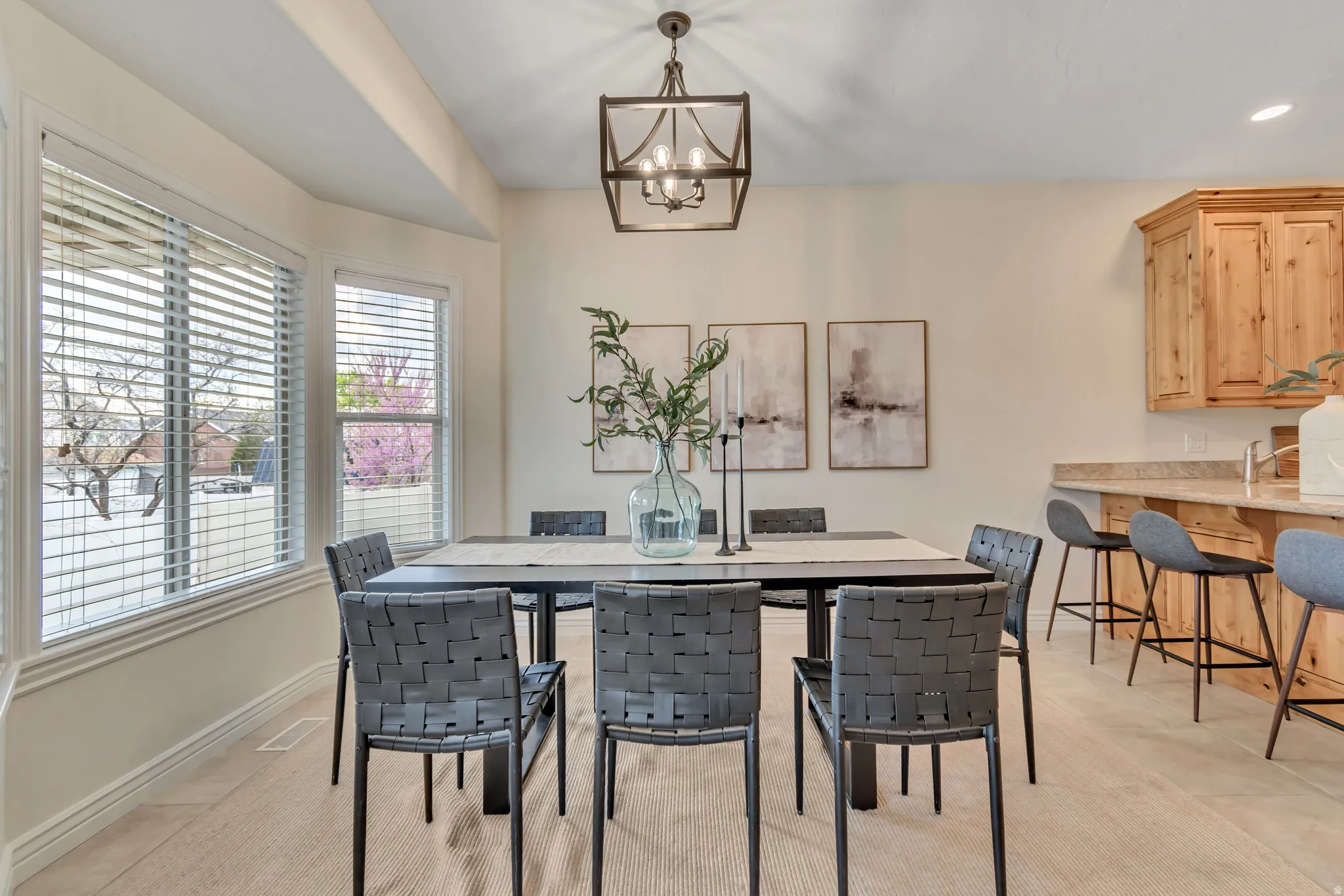 Dining area with a chandelier and baseboards