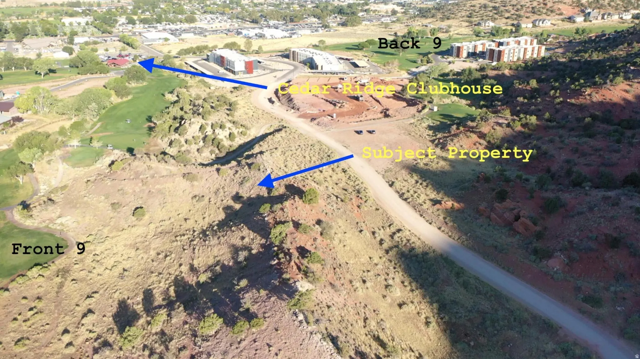 Aerial view of property's location with a local golf course and property parcel outlined