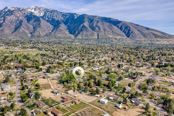 Aerial perspective of suburban area featuring a mountain backdrop