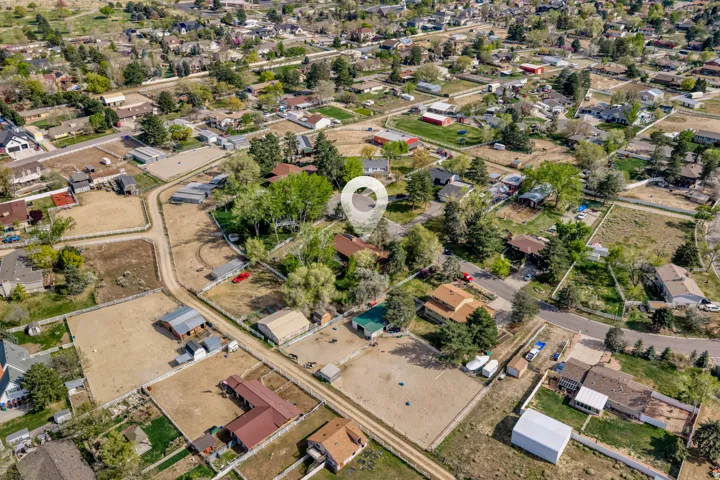 Aerial overview of property's location featuring nearby suburban area