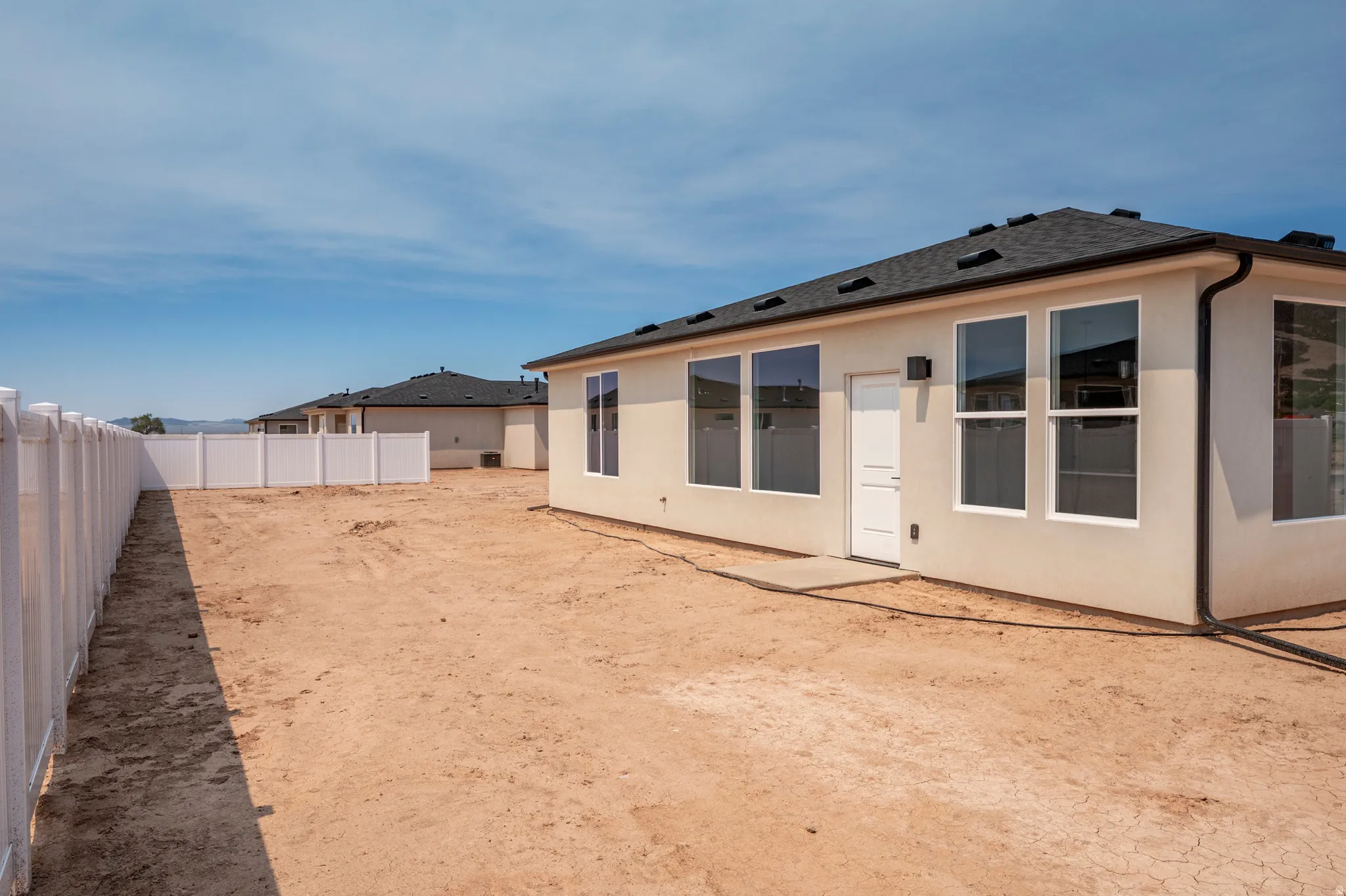 Spacious, undeveloped backyard offering significant customization potential