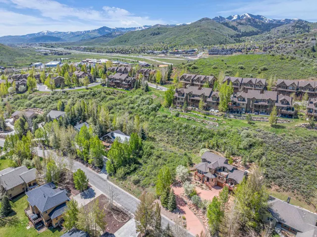 Aerial view of residential area featuring a mountainous background