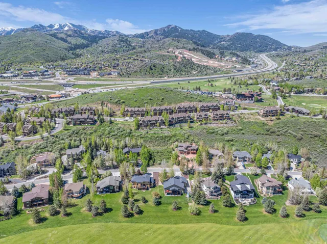 Aerial perspective of suburban area with a mountain backdrop
