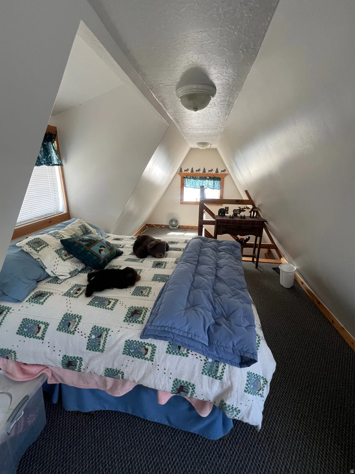 Carpeted bedroom #3 featuring a textured ceiling