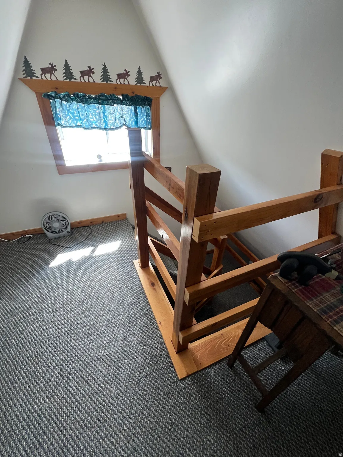 Stairs with carpet floors and baseboards