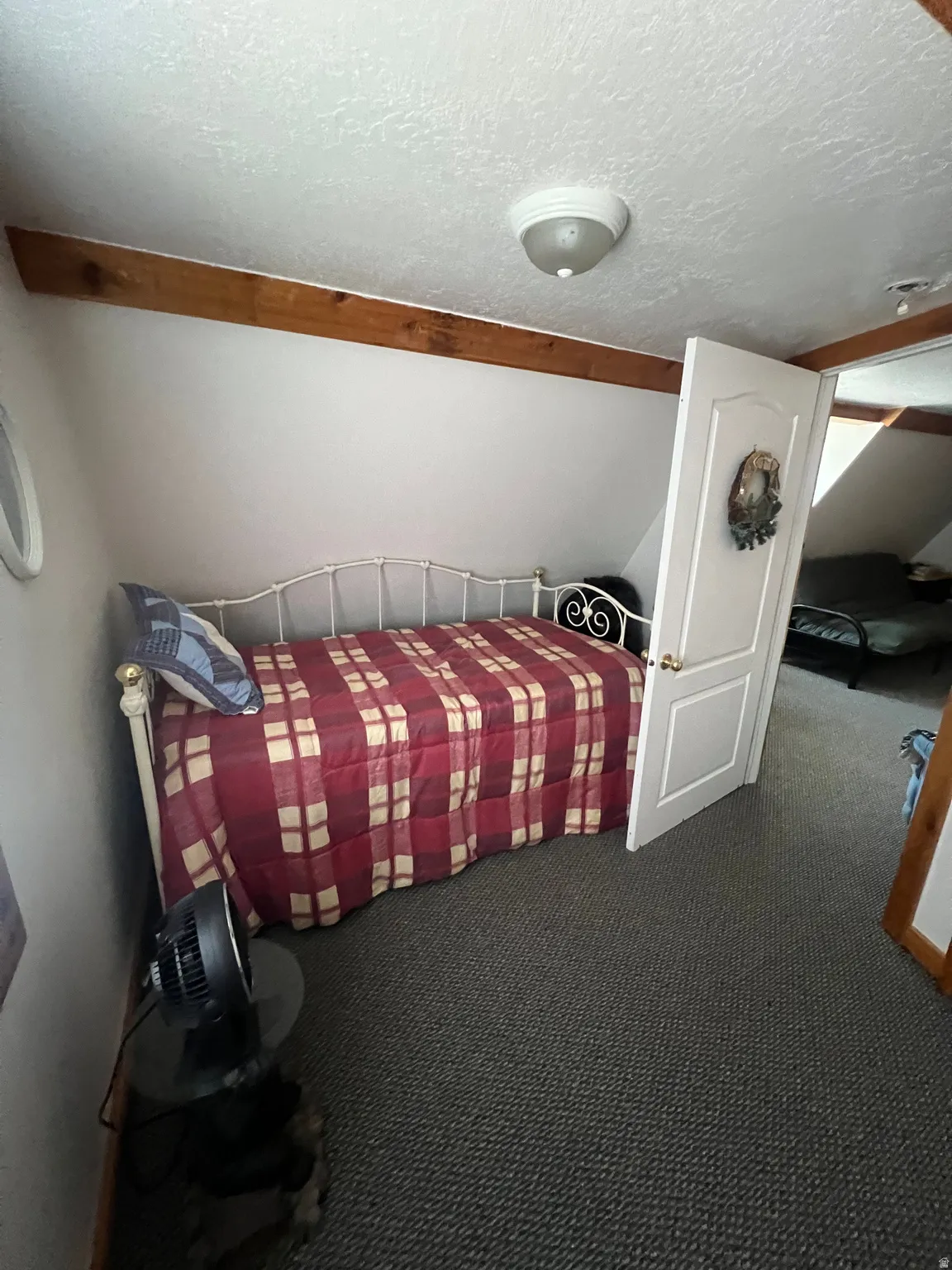 Carpeted bedroom #2 with a textured ceiling