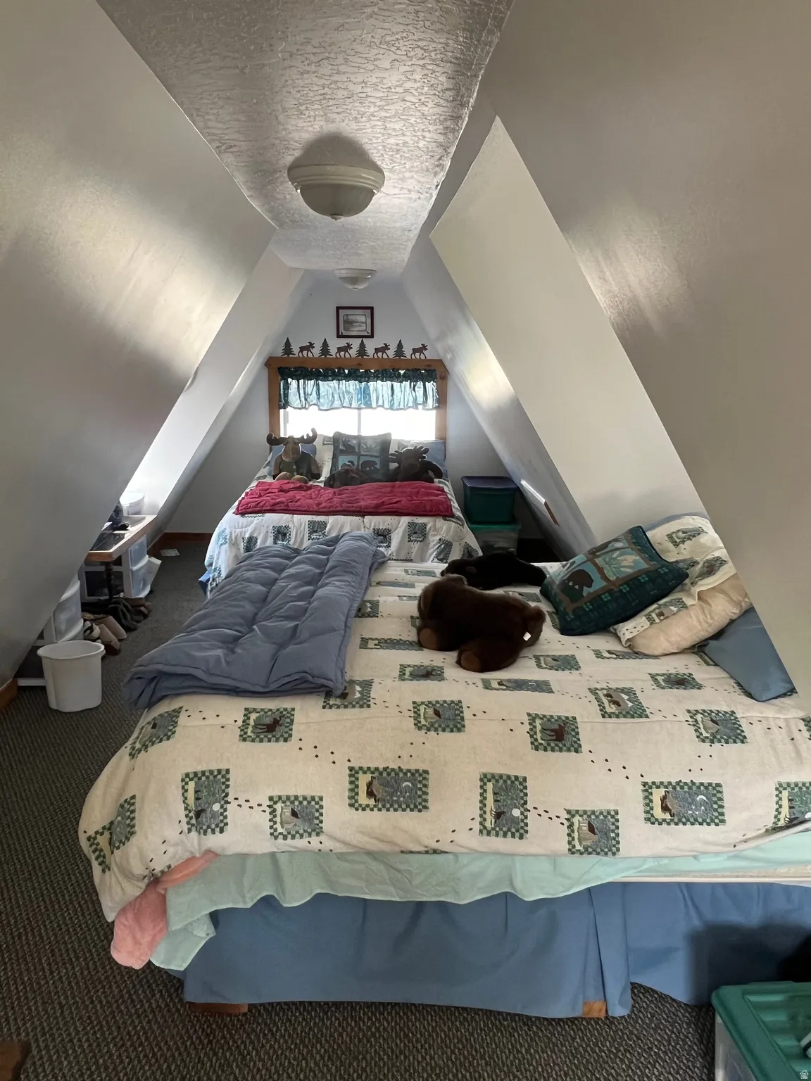 Bedroom #3 featuring a textured ceiling and carpet flooring