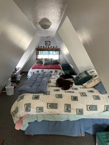 Bedroom #3 featuring a textured ceiling and carpet flooring
