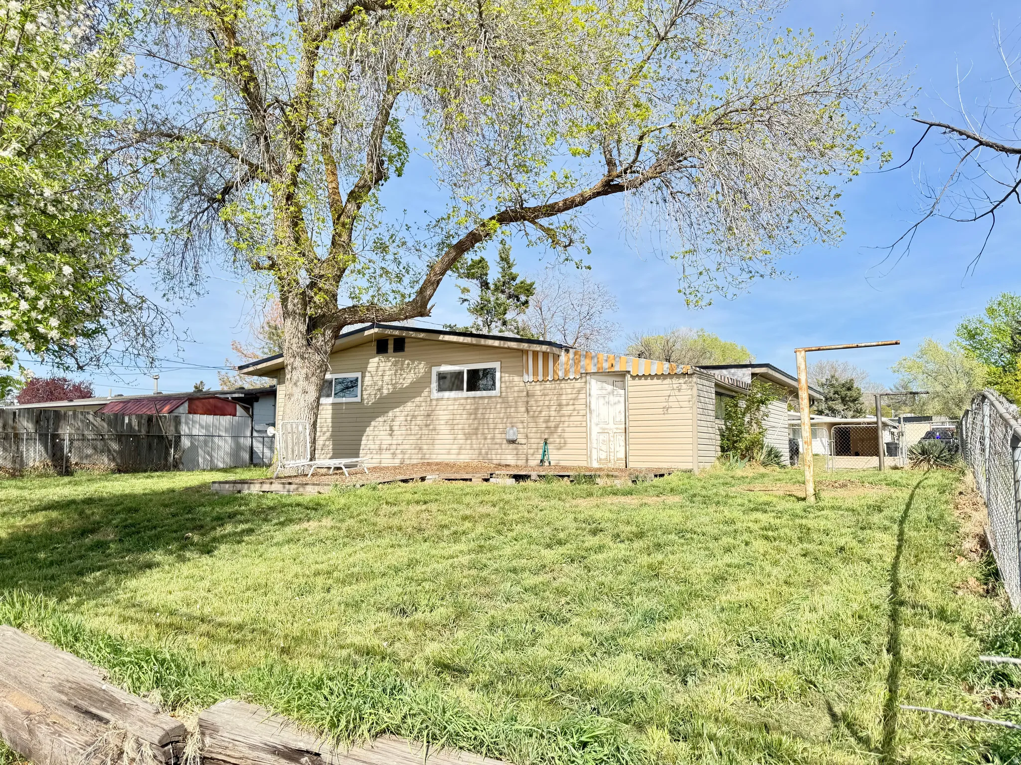 View of side of home featuring a fenced backyard