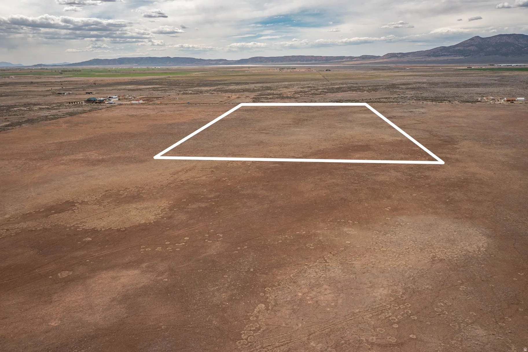 Aerial view of sparsely populated area featuring a mountain backdrop