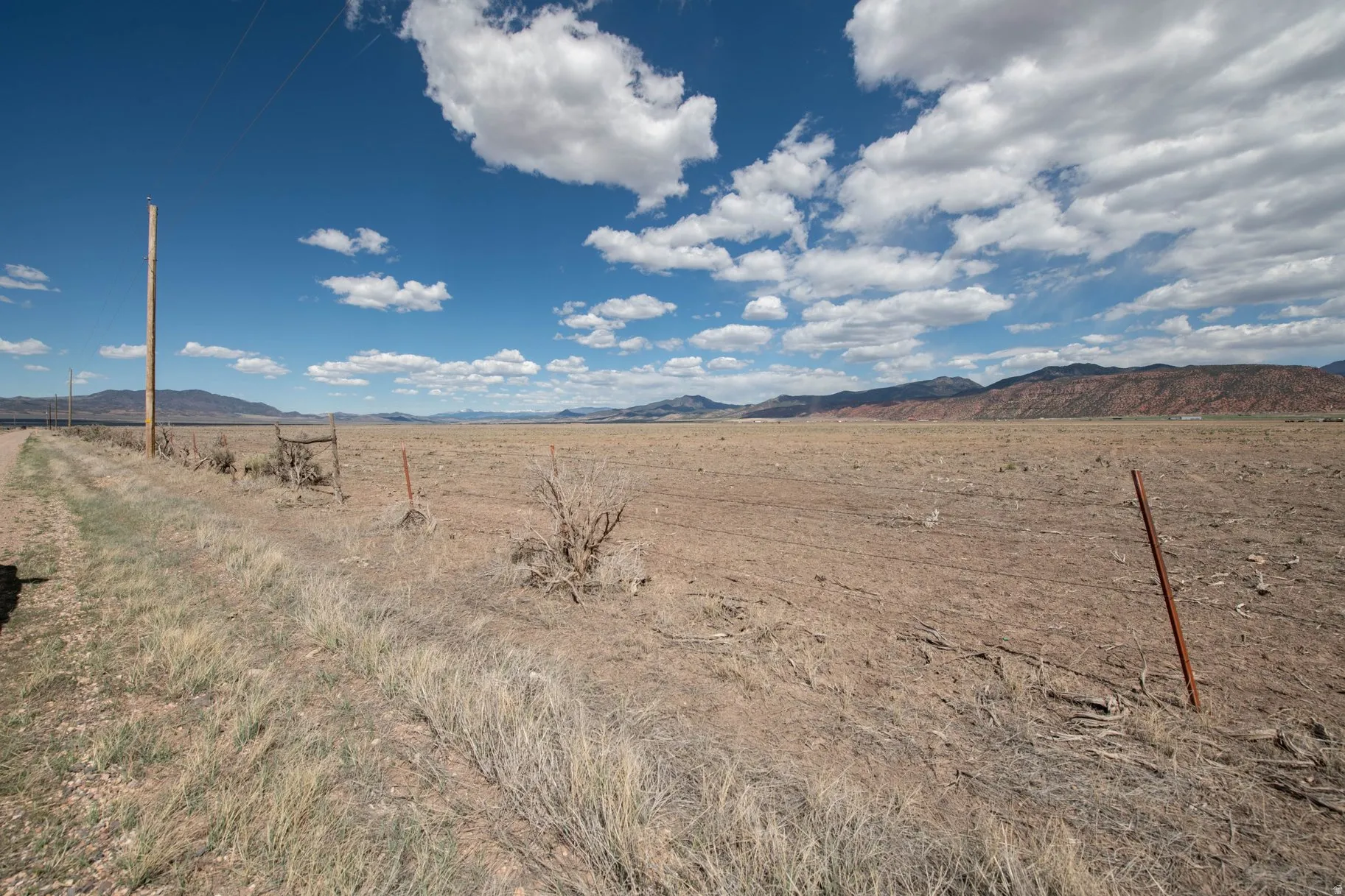 View of yard with a mountain view and a rural view