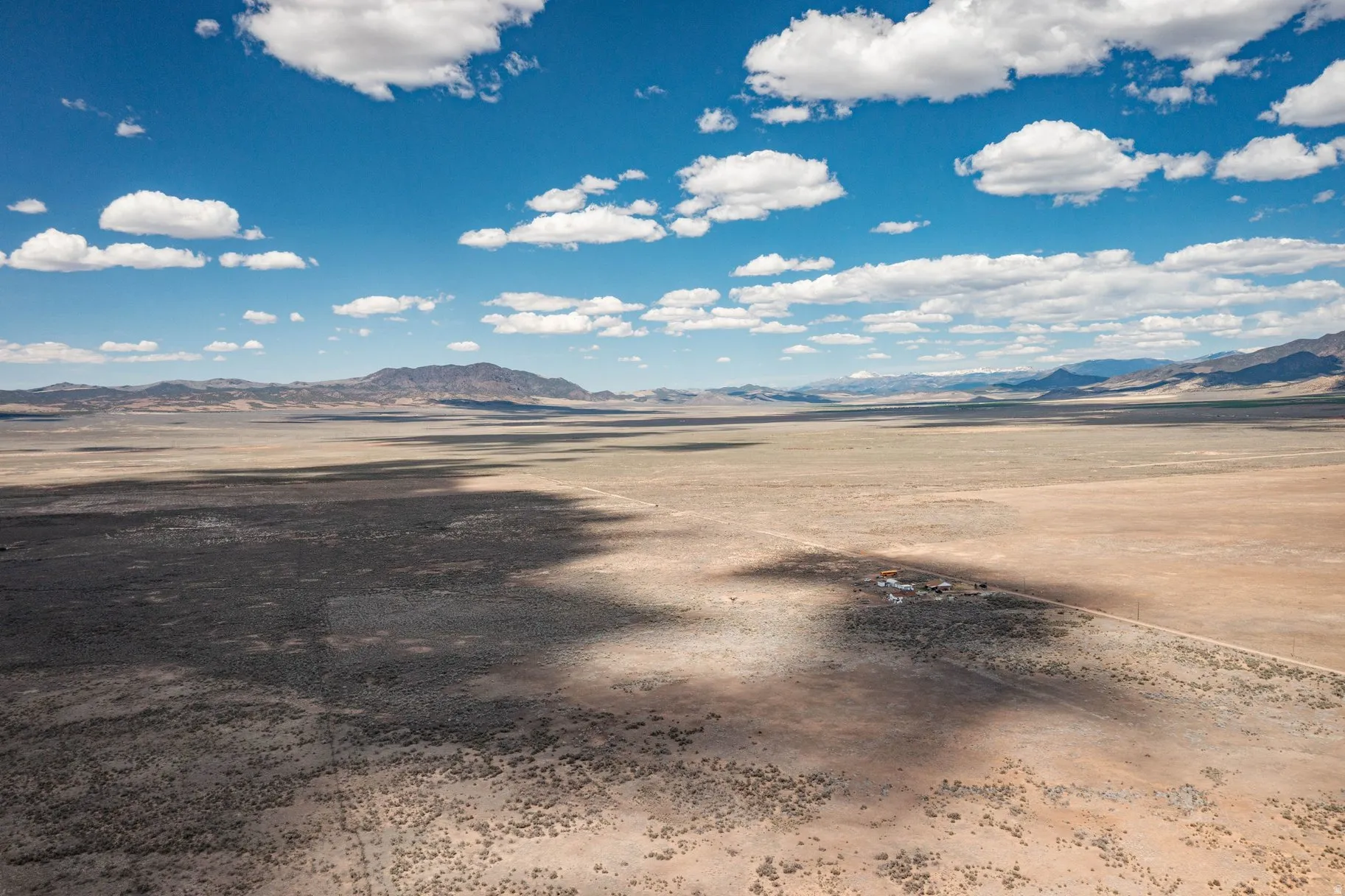 View of mountain backdrop featuring a desert landscape