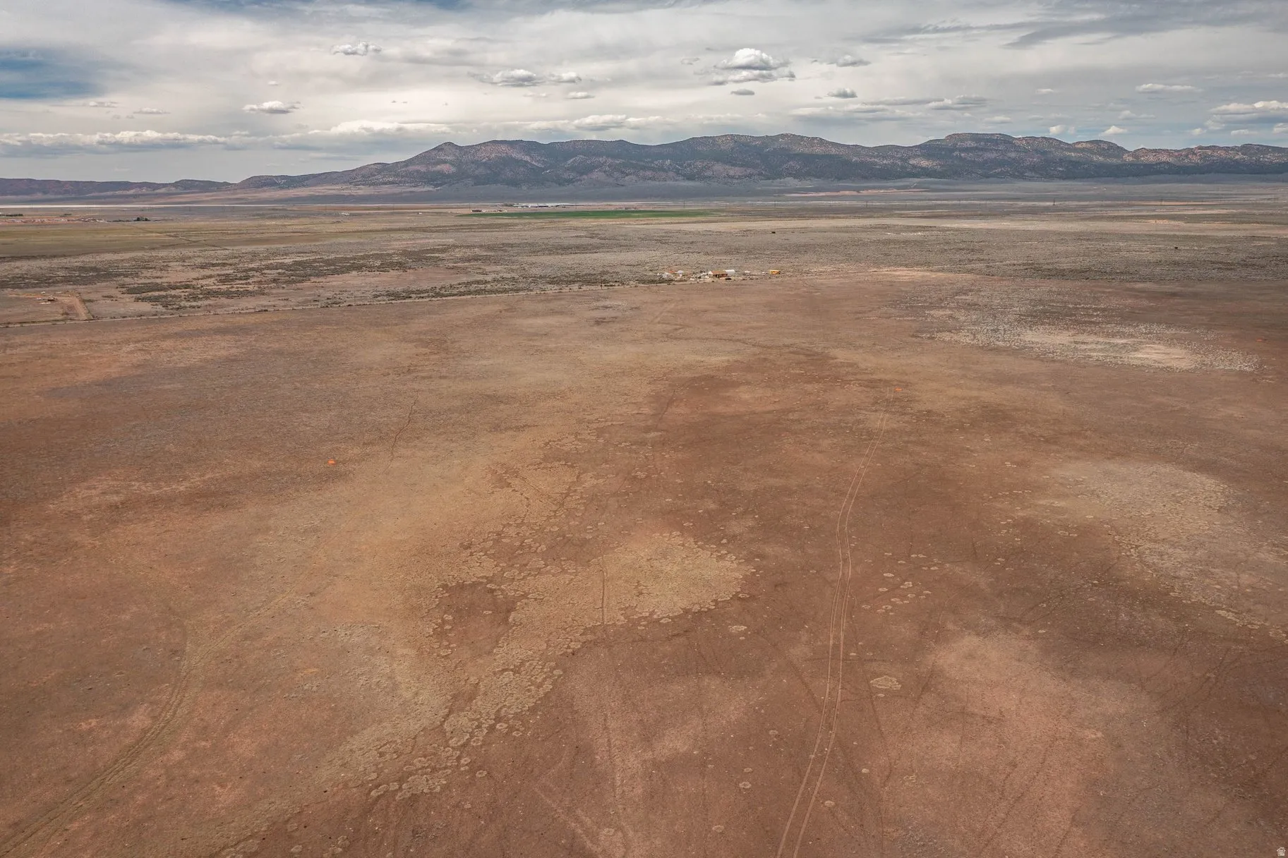 View of mountain background featuring rural landscape