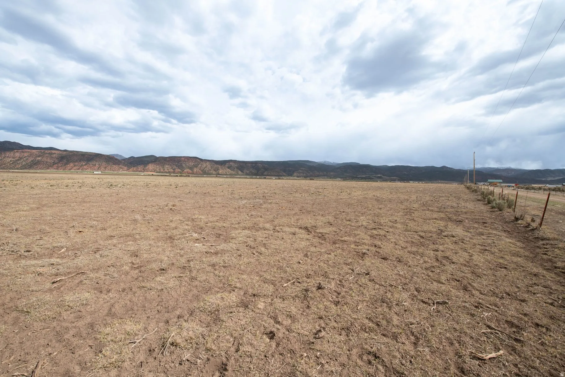 View of mountain backdrop featuring rural landscape