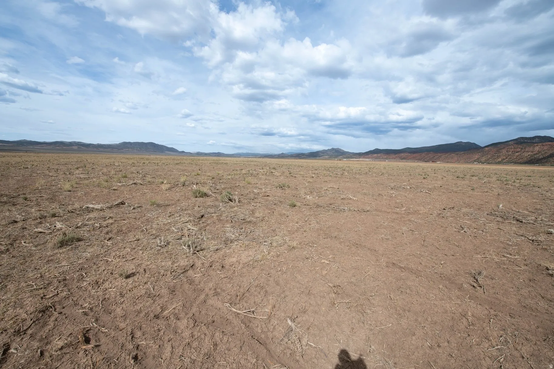 View of mountain backdrop with rural landscape