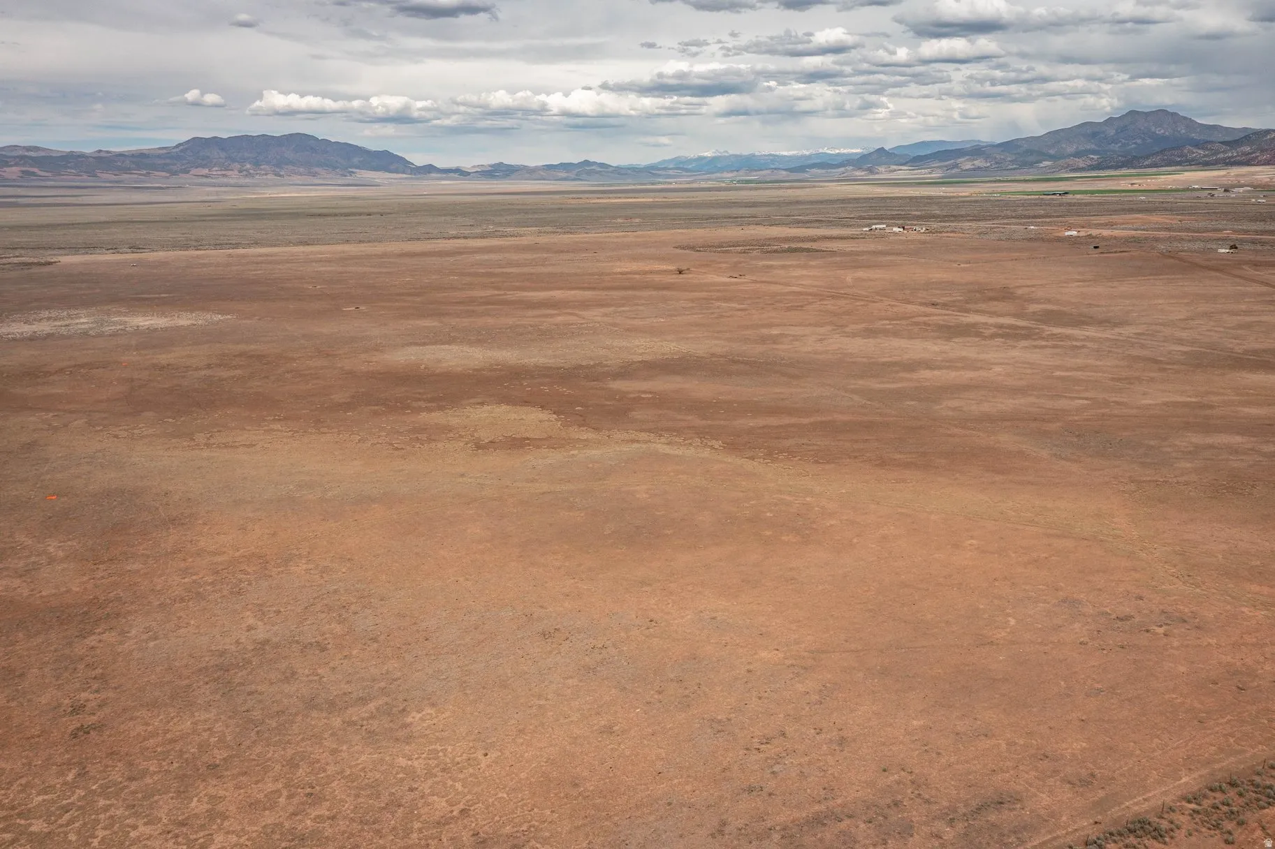 View of mountain background featuring rural landscape