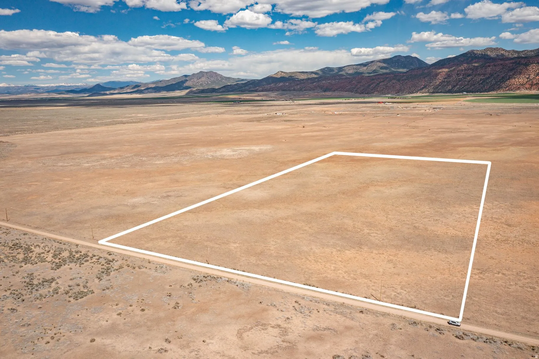 View of mountain backdrop featuring a desert landscape and rural landscape