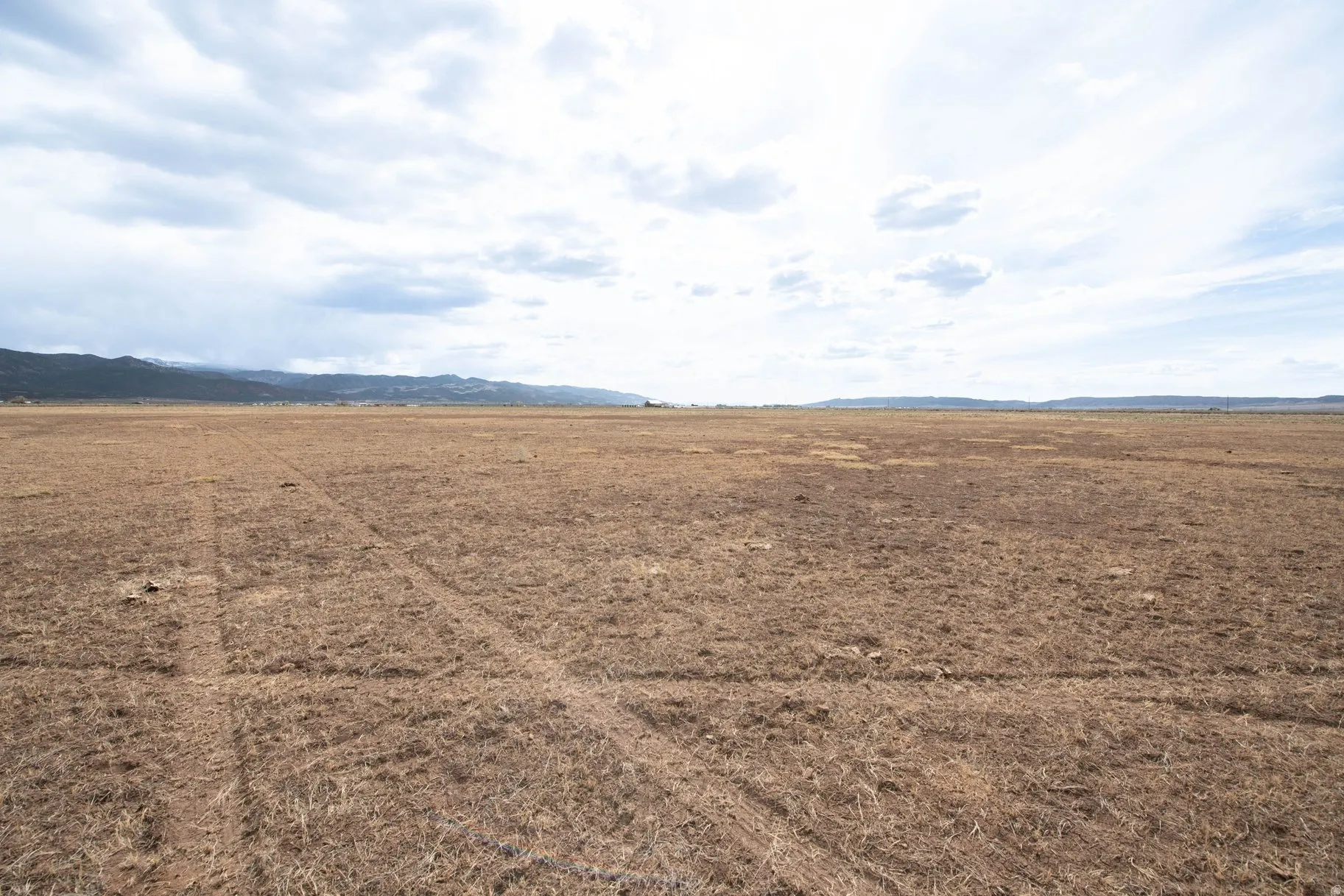View of mountain backdrop featuring rural landscape