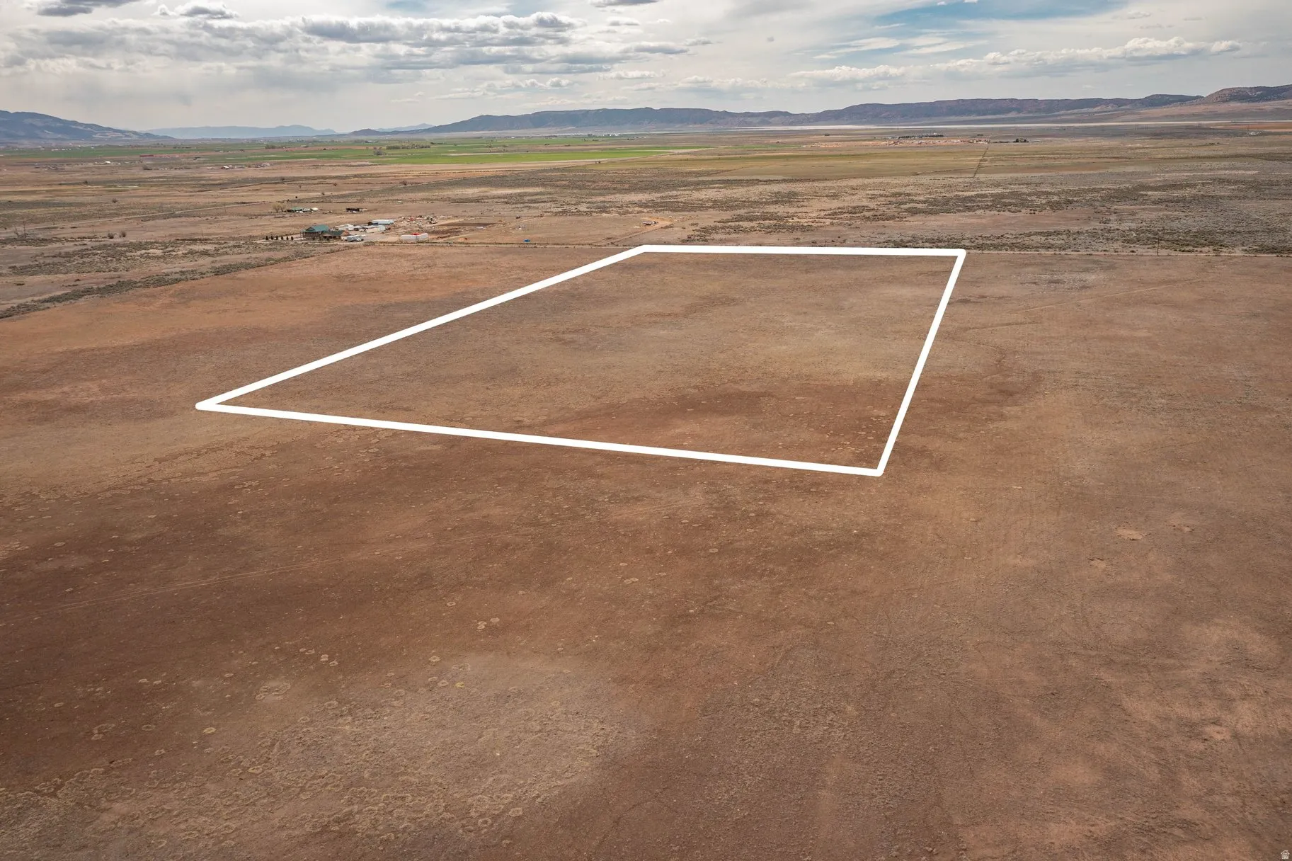 Overview of rural landscape featuring mountains and property boundaries highlighted
