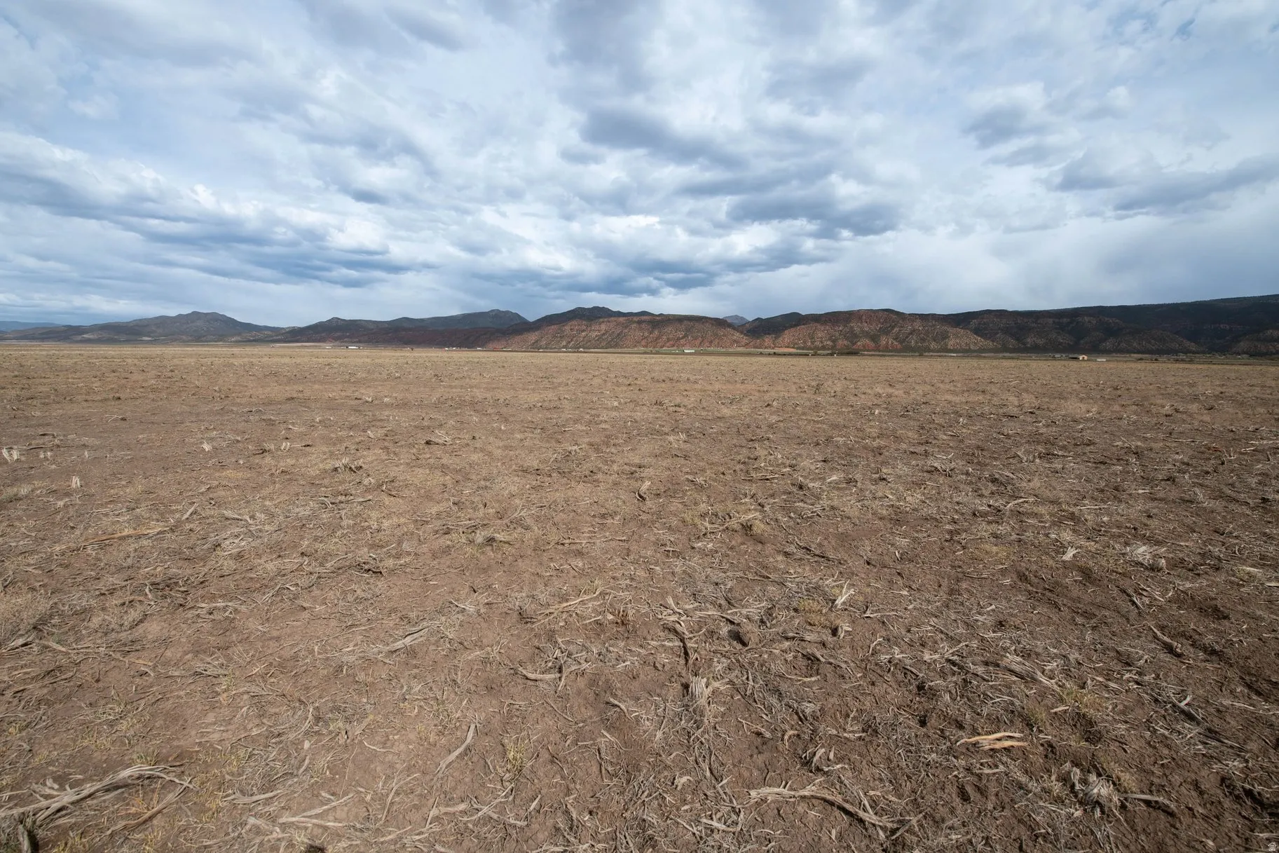 View of mountain background featuring rural landscape