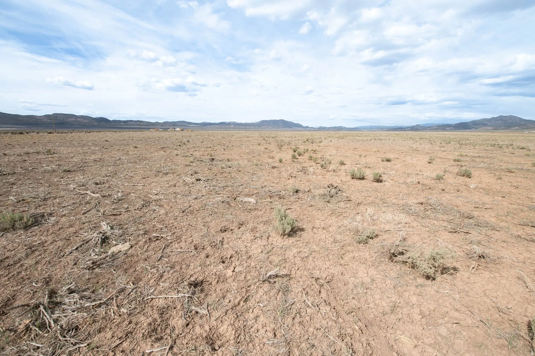 View of mountain backdrop featuring a desert landscape and rural landscape