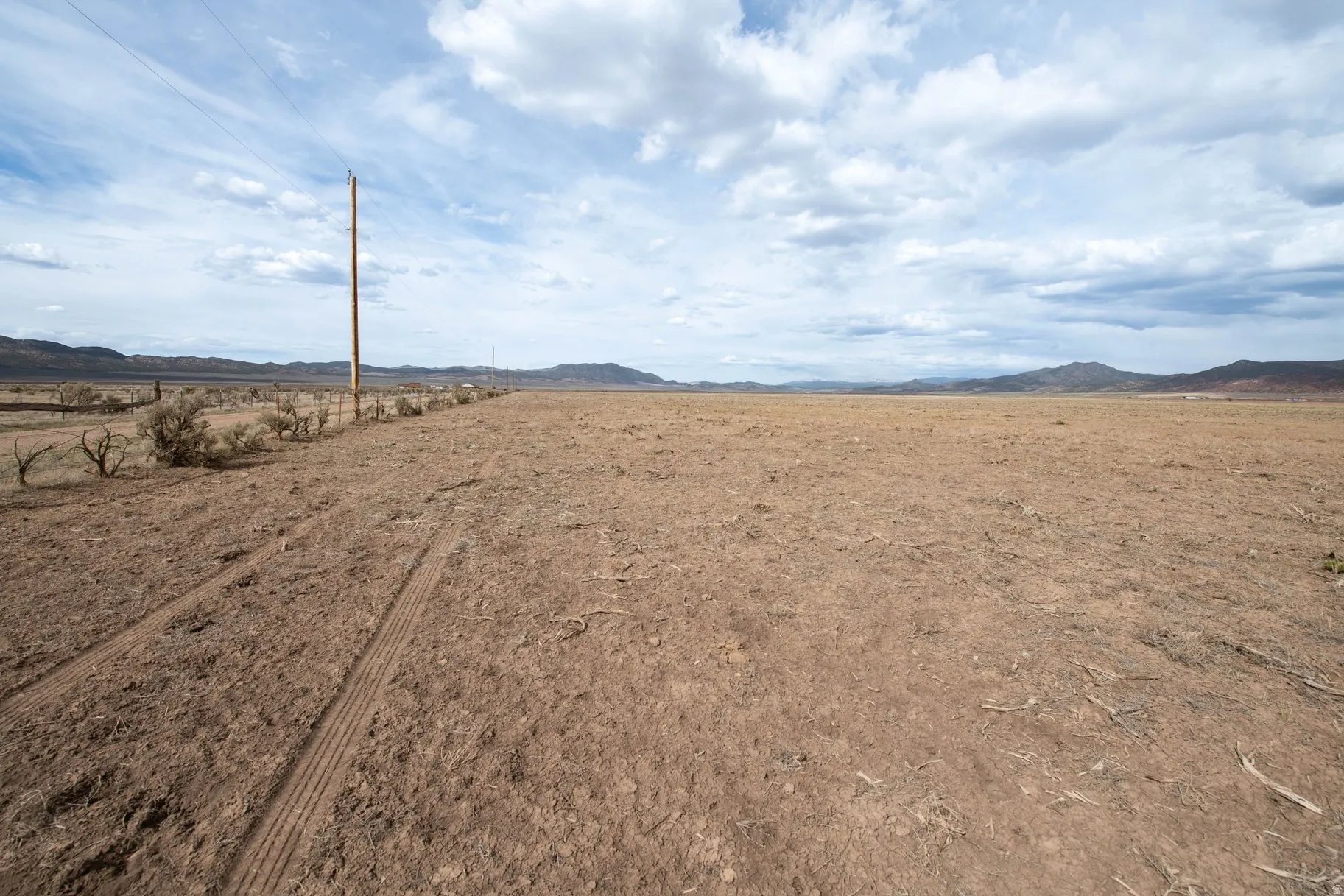 View of yard featuring a view of countryside and a mountain view
