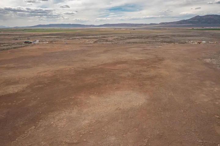 View of mountain backdrop with rural landscape