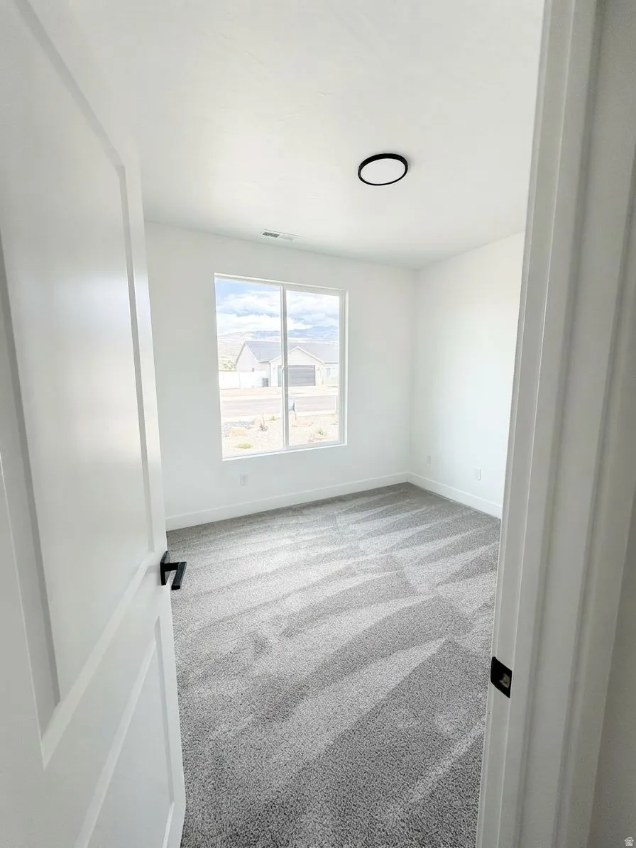 Neutral color palette with grey patterned carpeting