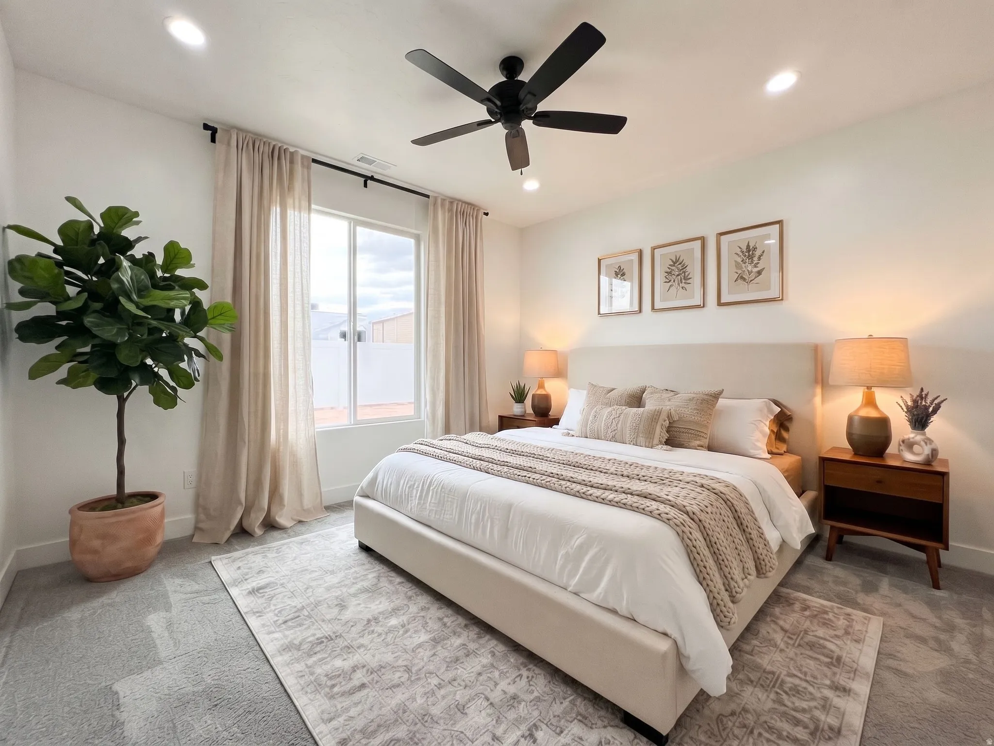 Ai Stage. Recessed lighting, ceiling fan, large window with drapes, upholstered headboard, and carpeted flooring