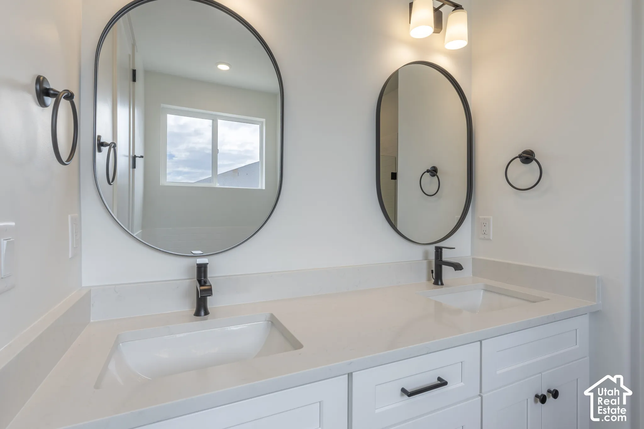 Dual oval mirrors with matte black frames