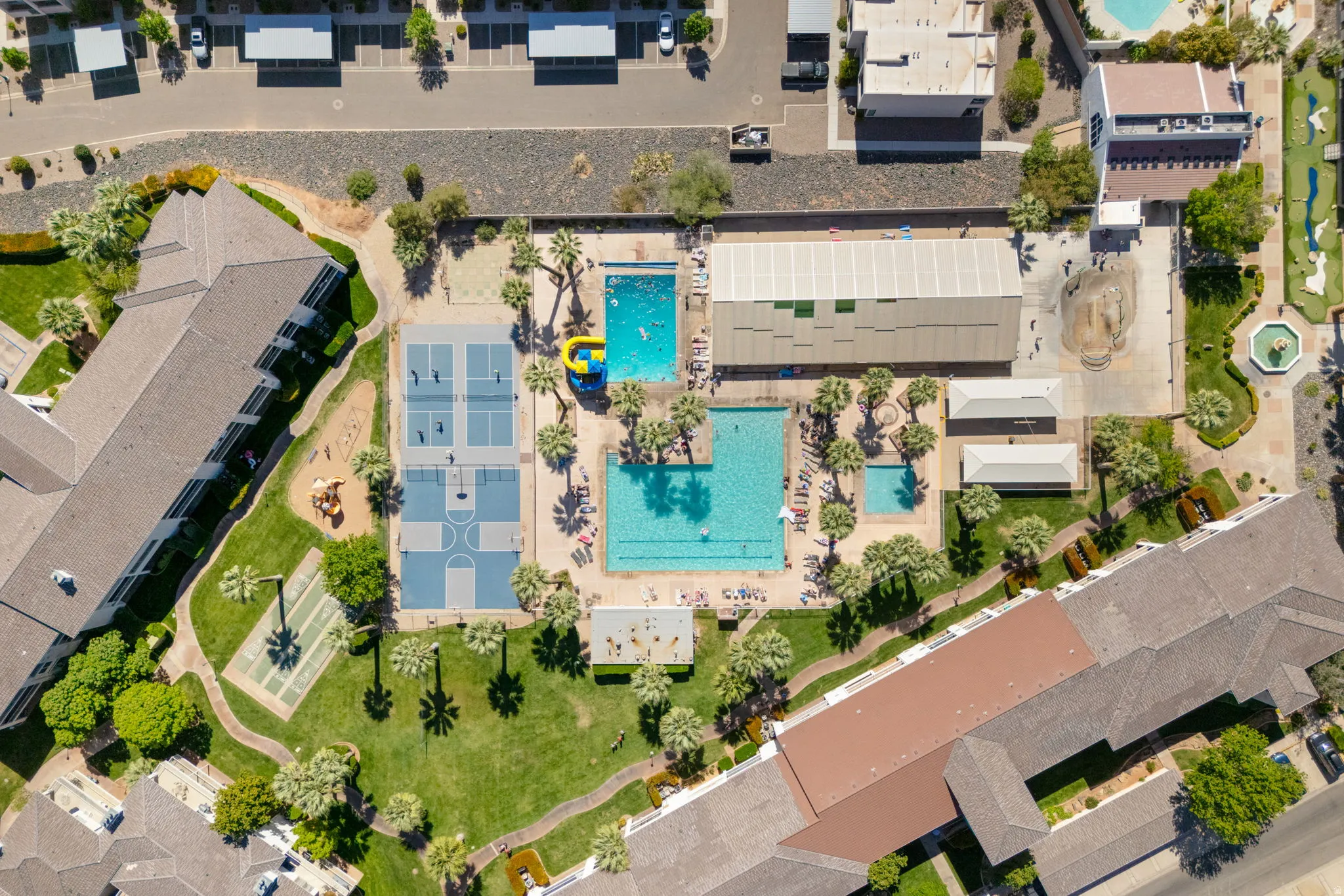 Aerial view of property's location with a pool area