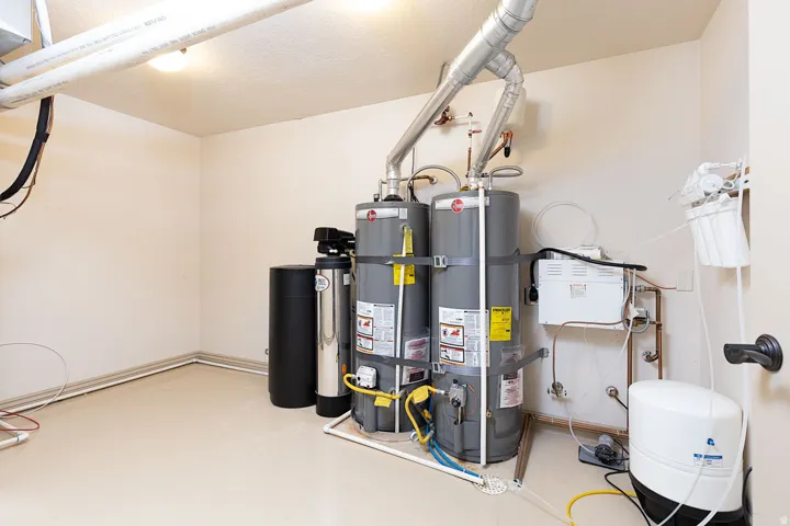 Utility room featuring water heater