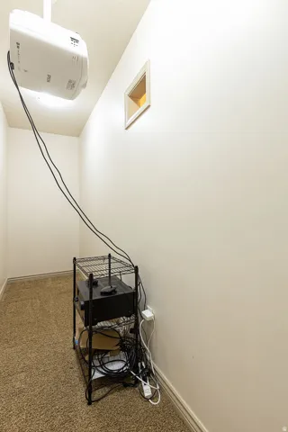 Staircase featuring carpet flooring and baseboards