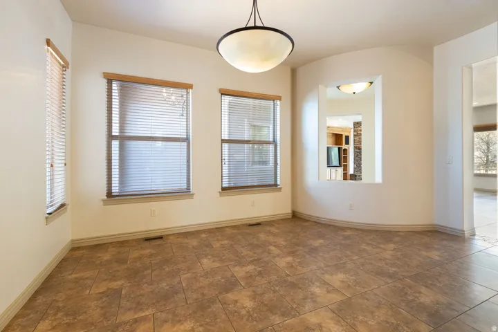 Unfurnished room with baseboards