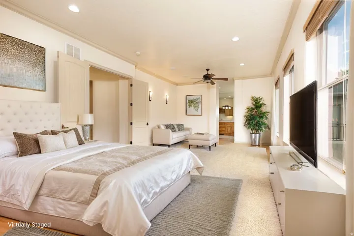 Bedroom with crown molding, light carpet, recessed lighting, ensuite bath, and a ceiling fan