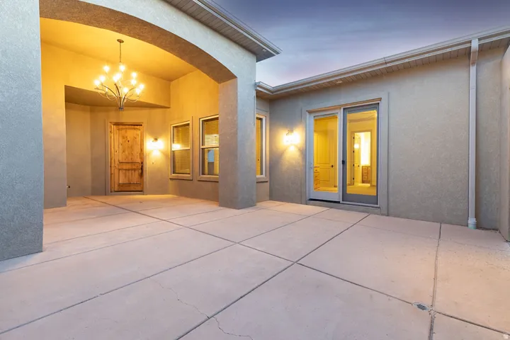 Back of house featuring a patio area and stucco siding