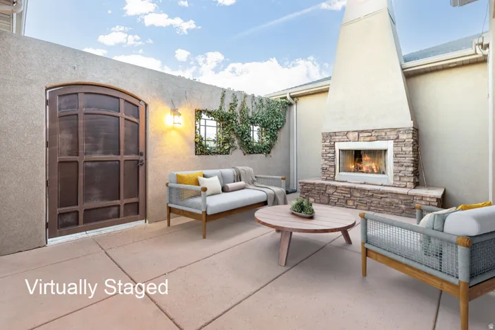 View of patio / terrace with an outdoor living space with a fireplace