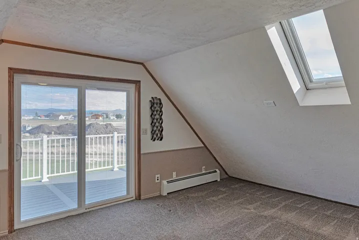 Bonus room featuring healthy amount of natural light. Could be used as a bedroom, bonus or family room.