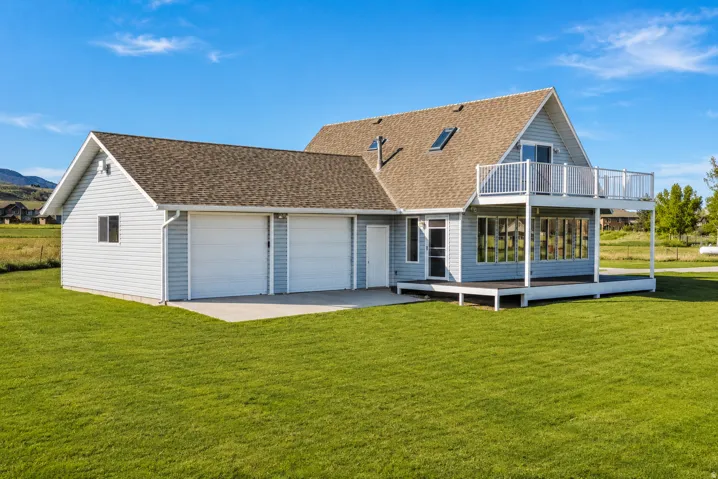 Light blue siding exterior with a two-car garage