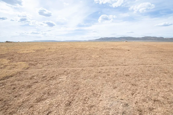 View of undeveloped land featuring rural landscape and a mountainous background