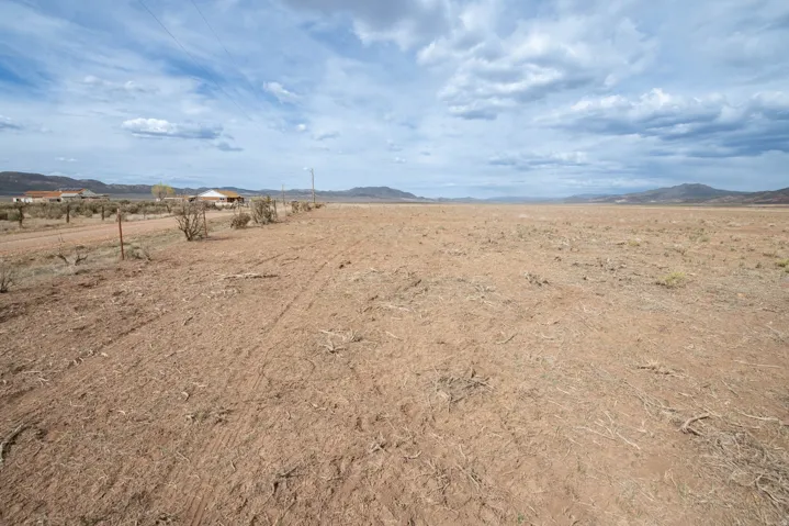 View of yard featuring a mountain view and a view of rural / pastoral area