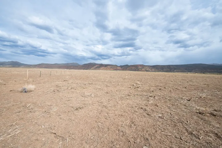 View of mountain backdrop with rural landscape