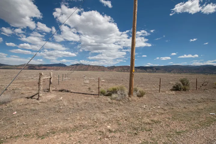 View of yard featuring a mountain view and a view of countryside