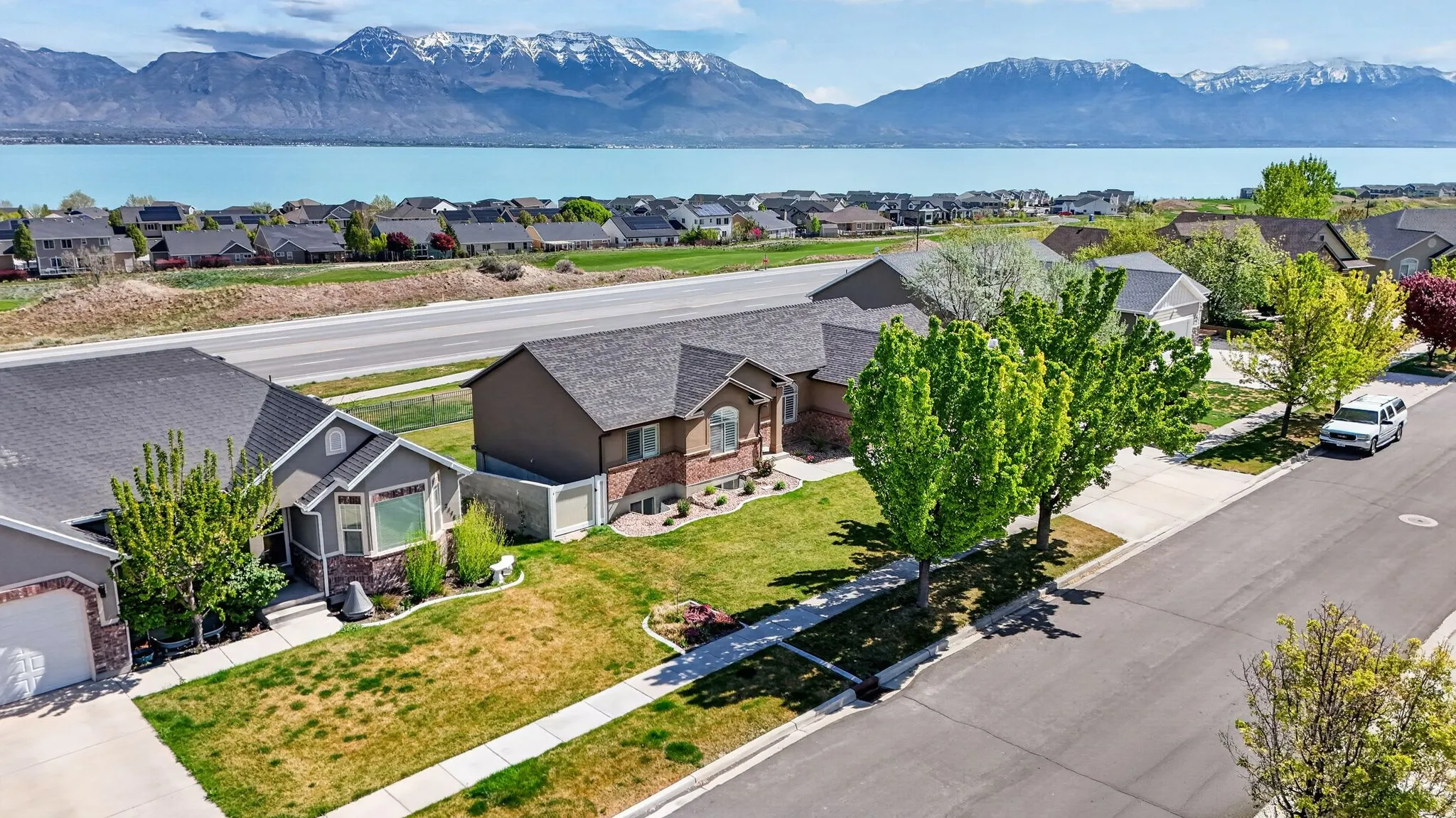 Aerial perspective of suburban area featuring a water and mountain view