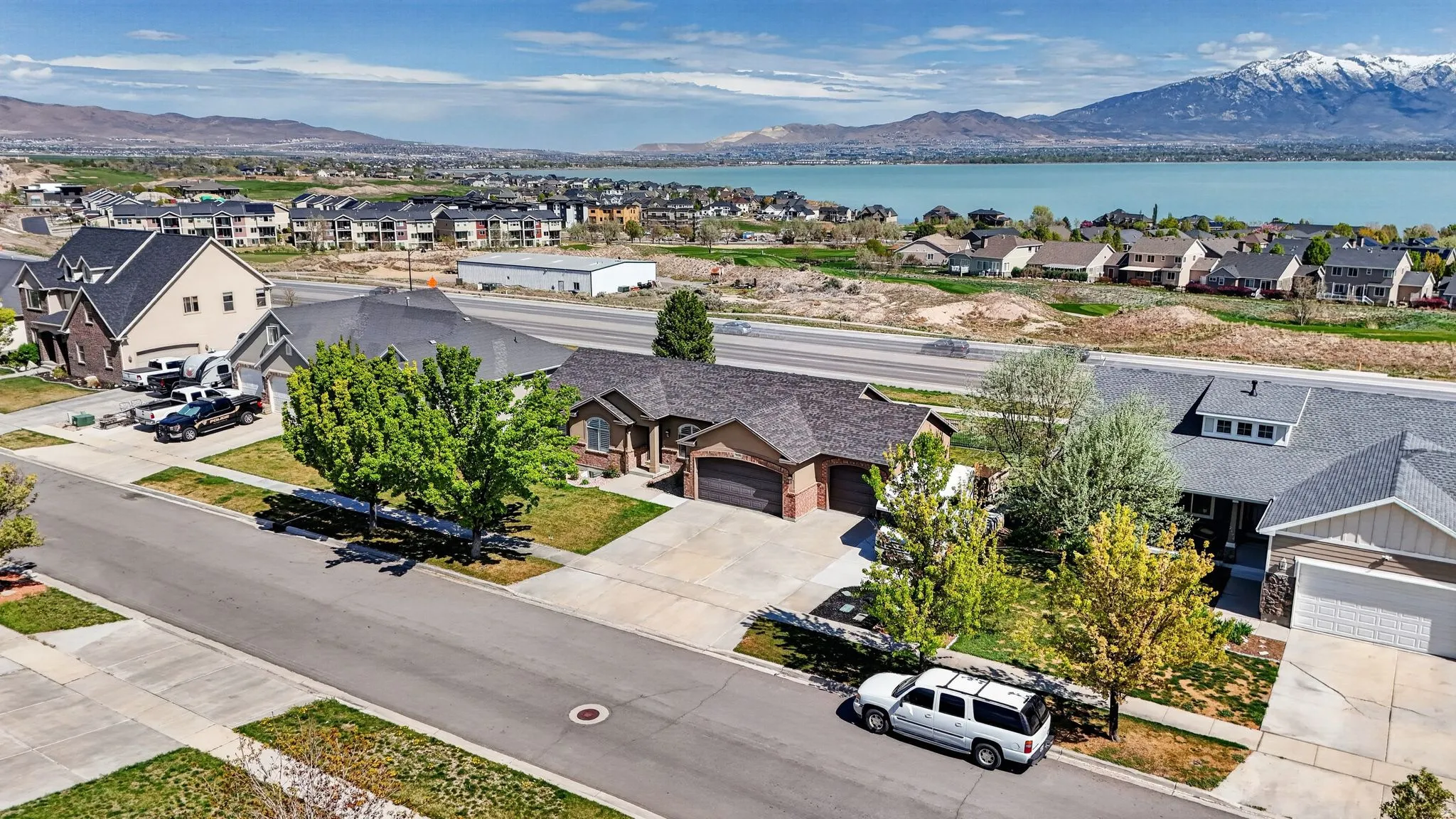 Aerial perspective of suburban area featuring a water and mountain view