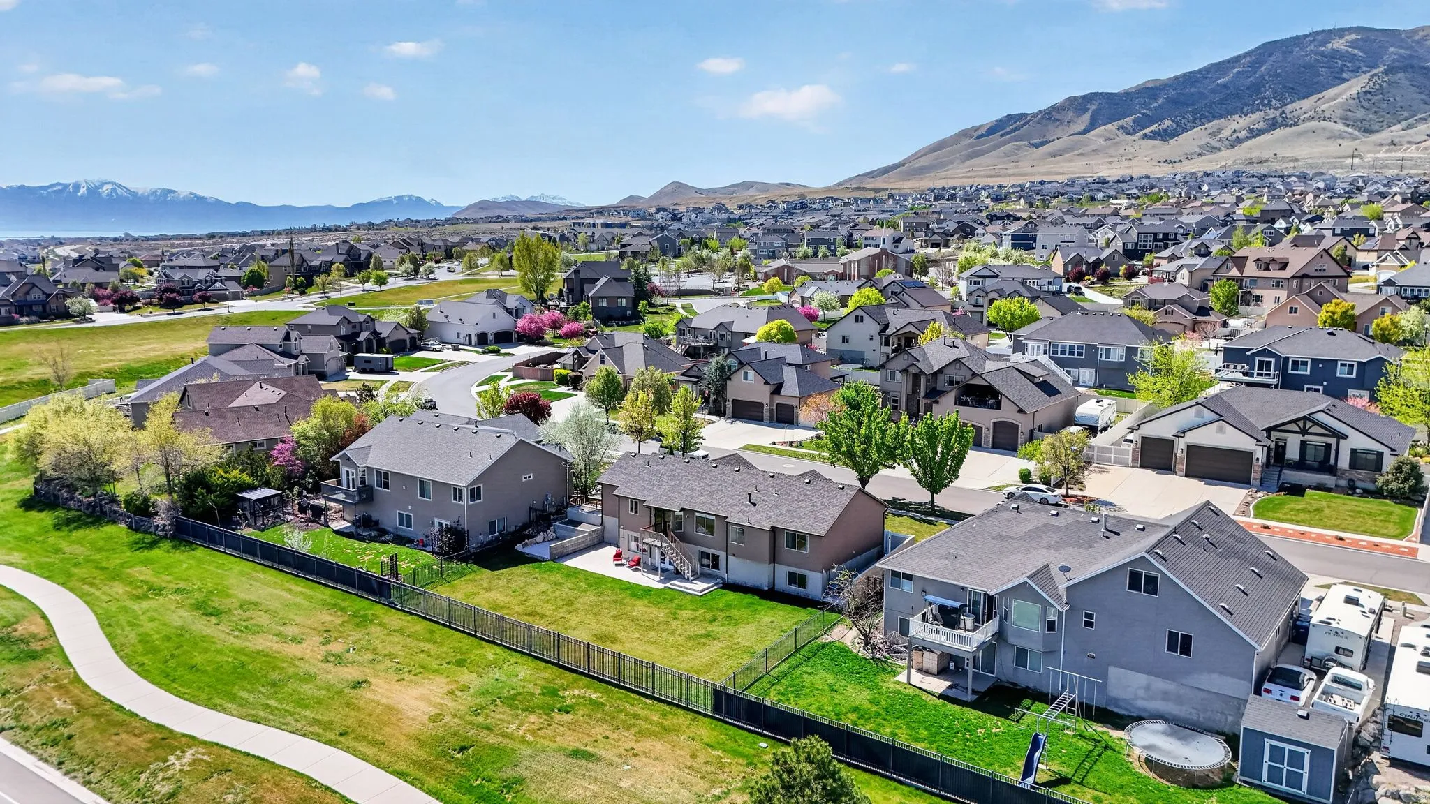 Aerial perspective of suburban area featuring a mountainous background