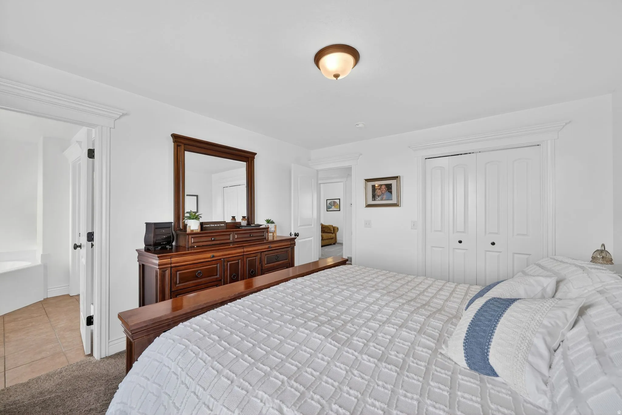 Bedroom featuring a closet and tile patterned flooring