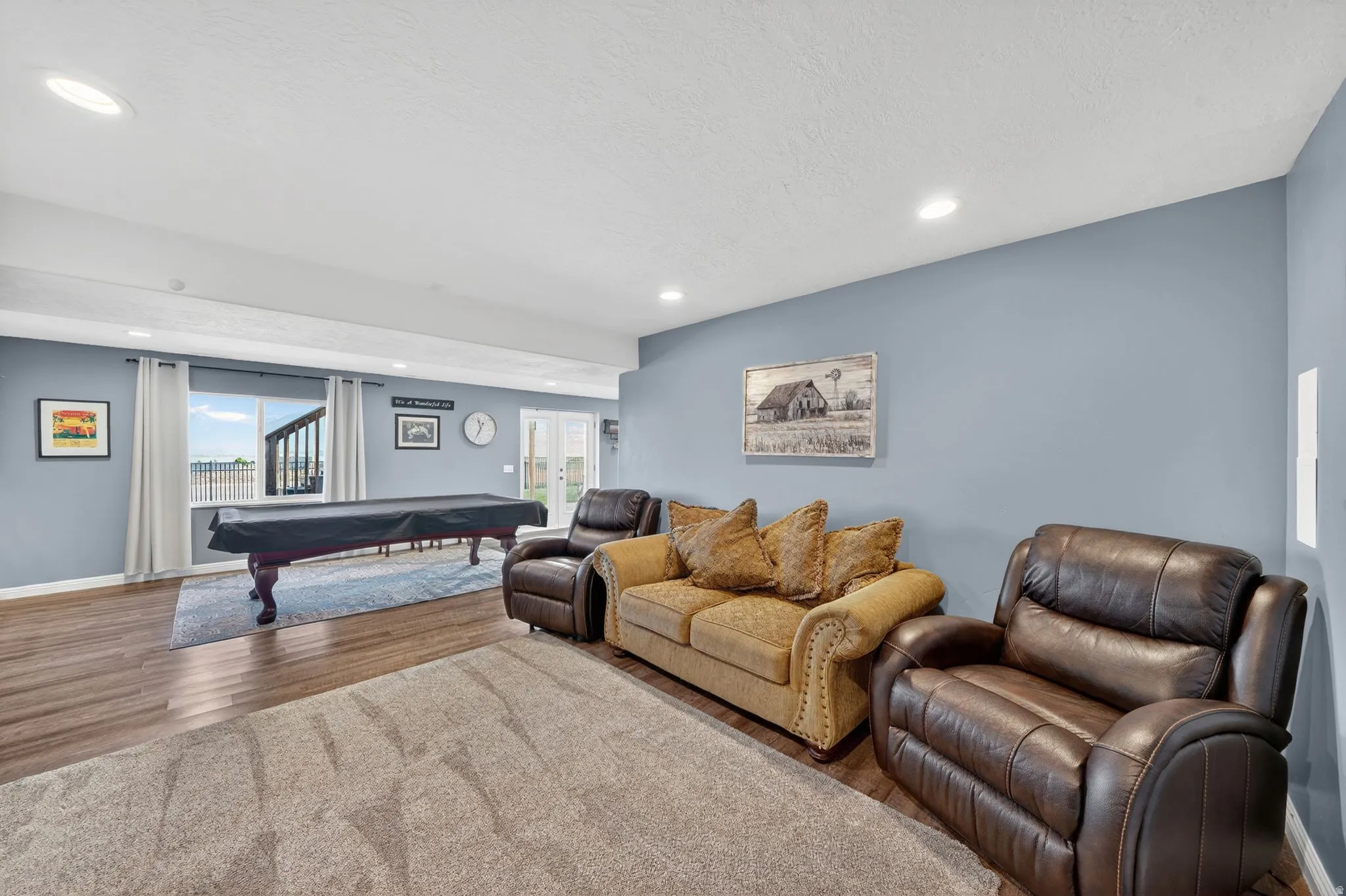 Living room featuring pool table, wood finished floors, french doors, a textured ceiling, and recessed lighting